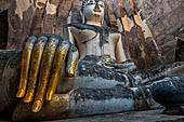 Thailand - Old Sukhothai - Wat Si Chum the roofless mondop enshrines the impressive 15 meter high seated Buddha named Phra Achana.  